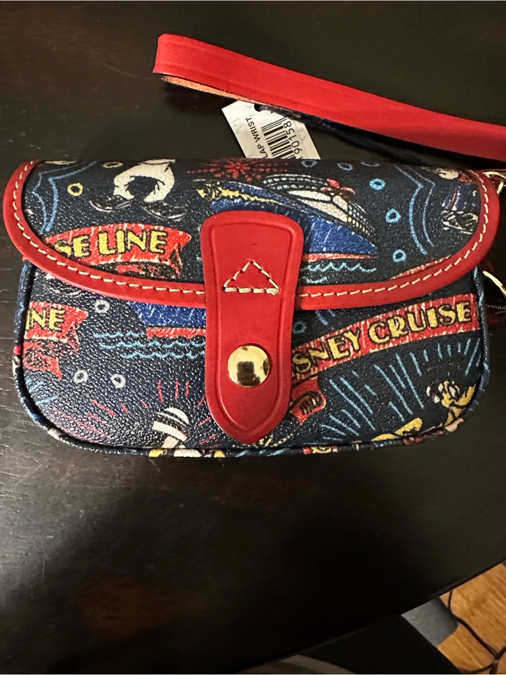 Dooney & Bourke Navy Disney Print Wristlet with Red Trim